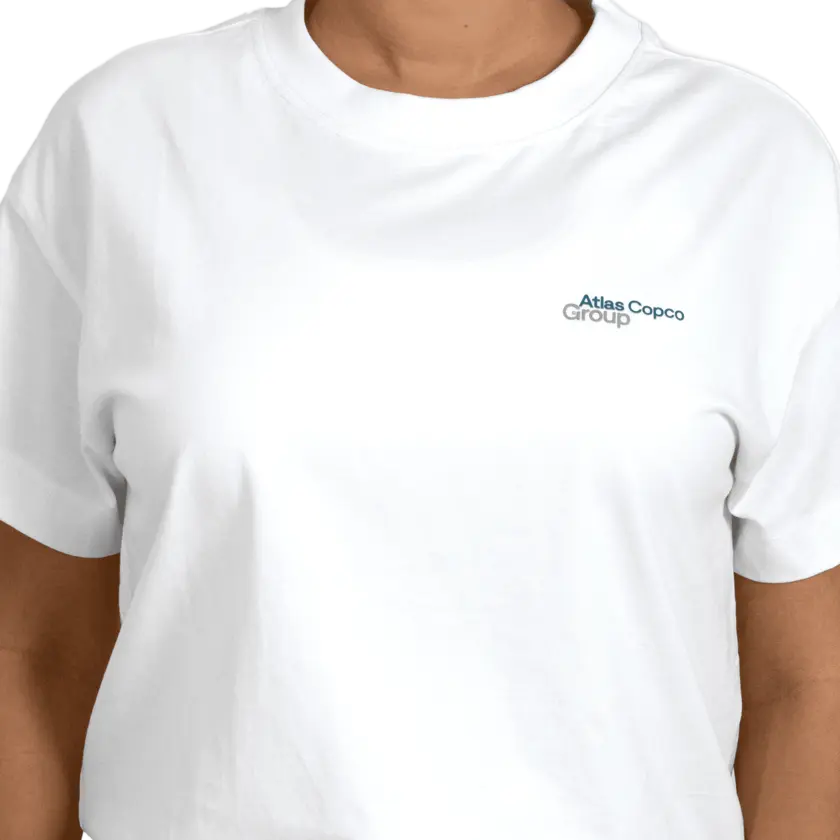 woman wearing white tshirt with atlas copco group logo