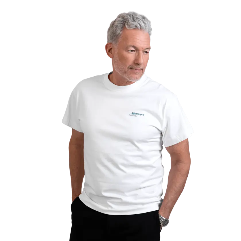 man wearing white tshirt with atlas copco group logo