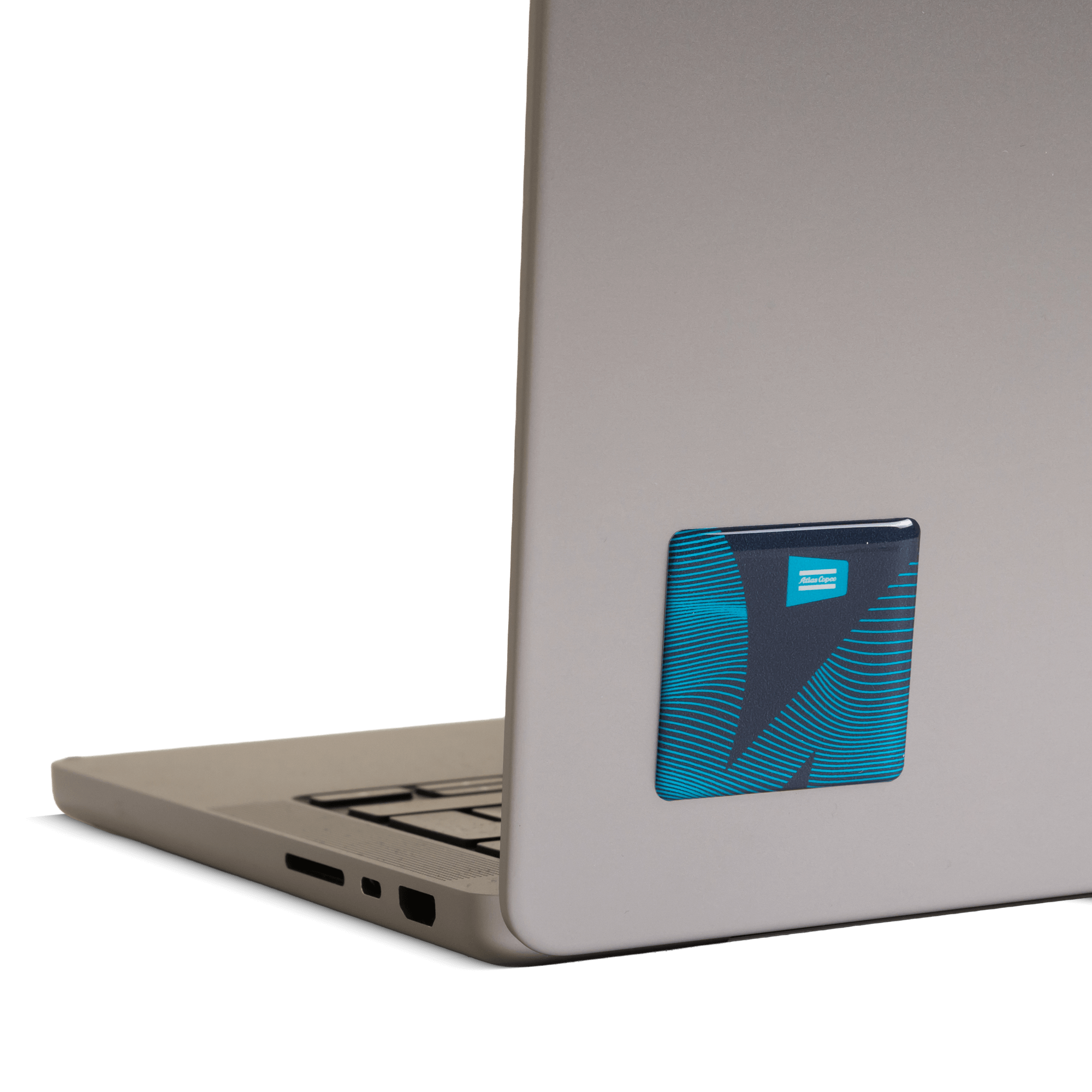 Atlas copco stickers with level up the experience text and graphics on laptop